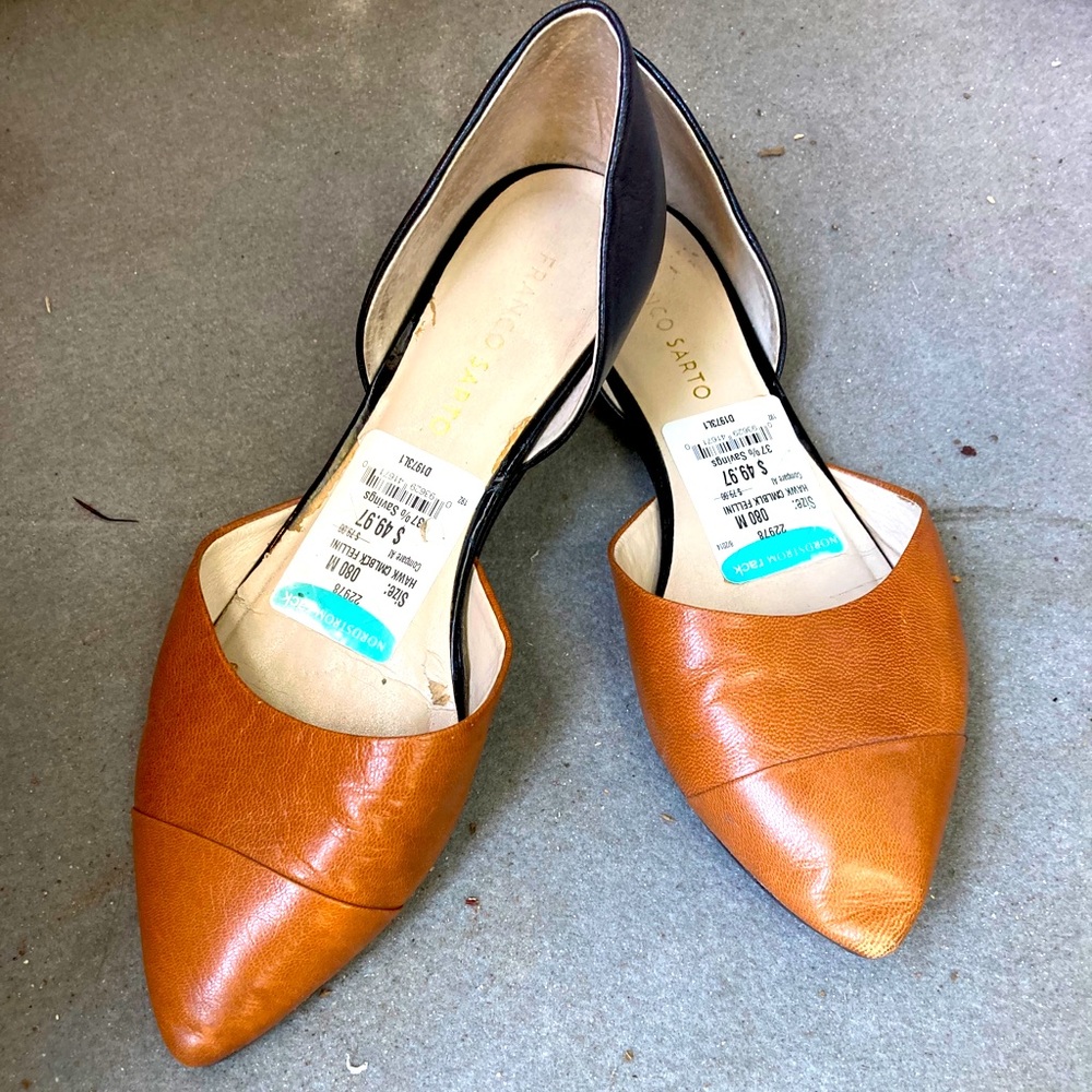 Black and brown Franco Sarto flats.